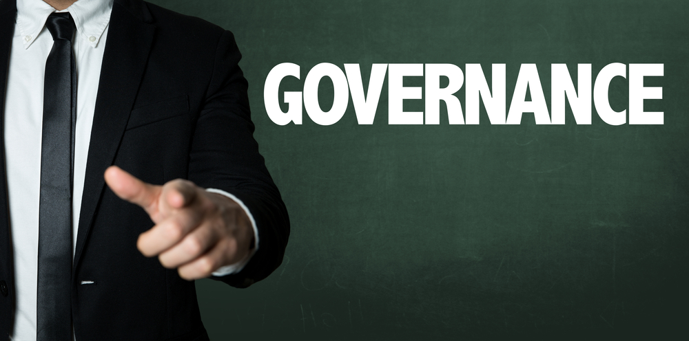 Business,Man,Pointing,With,The,Text:,Governance