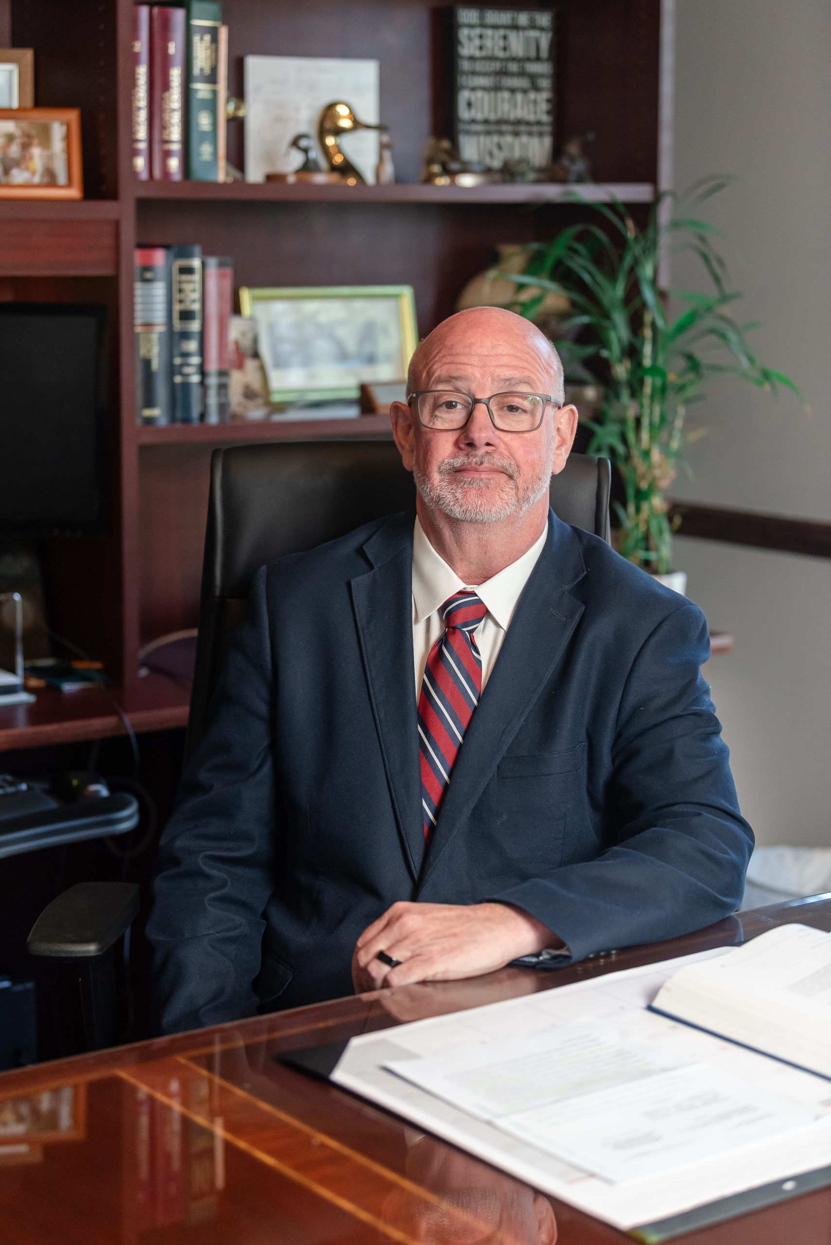 image shows Attorney Christopher Pearce of Pearce Law Group in Myrtle Beach SC Seated at his desk